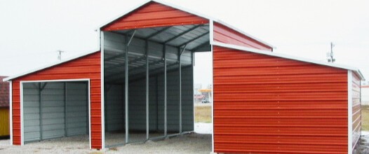 Steel barn with open center bay and red roof
