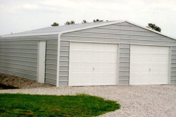 Steel garage with two roll-up doors in gray
