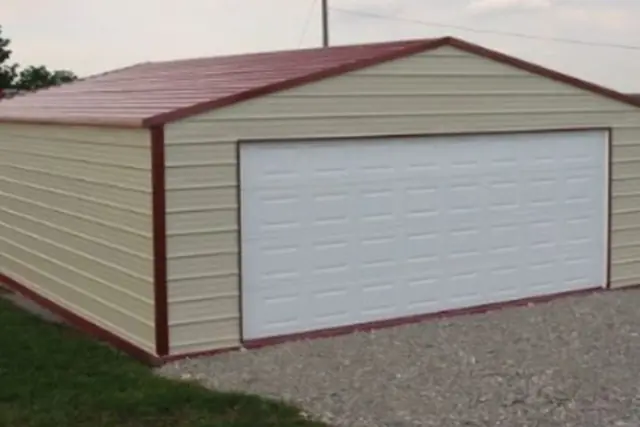 Two-car steel garage, tan walls with red roof and trim