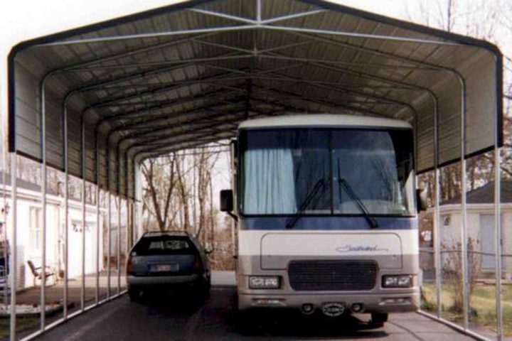 Tall steel RV cover with a motorhome parked under it